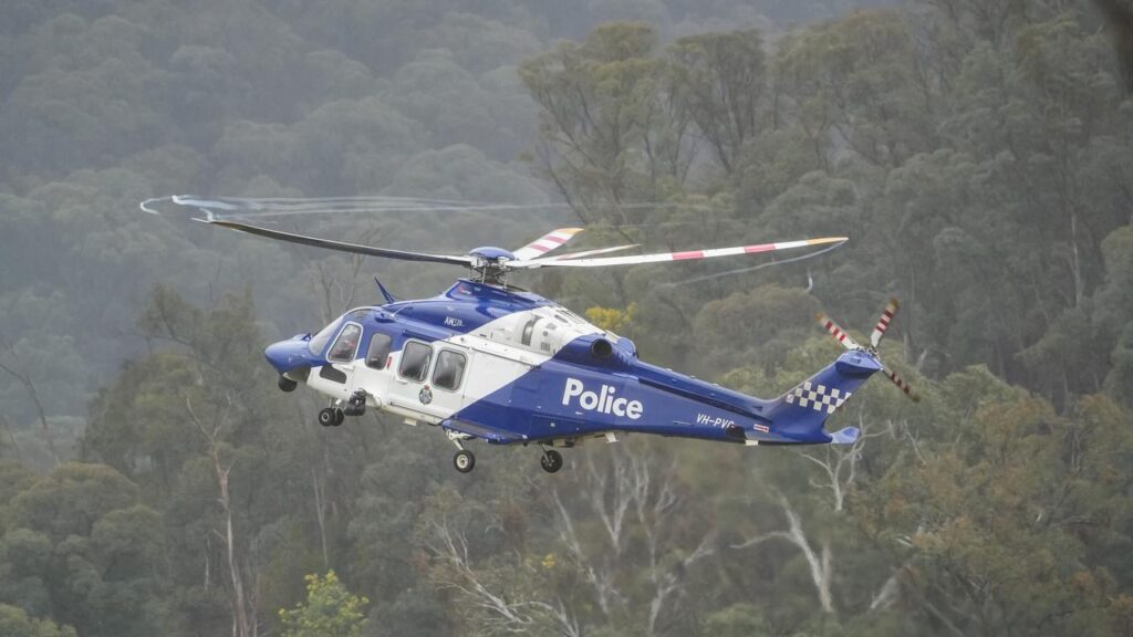 Conditions are forecast to deteriorate as police hunt a fugitive accused of killing two officers.