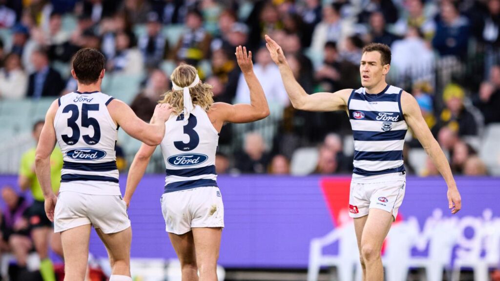 Coleman medallist Jeremy Cameron (right) kicked four goals as the Cats tore apart the Tigers.