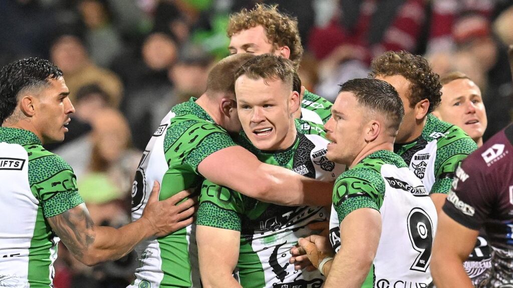 Young Canberra star Ethan Strange (c) scored three tries as the Raiders defeated Manly.