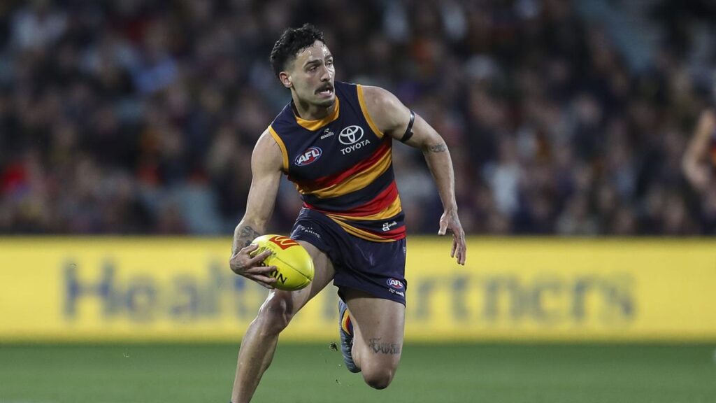 Banned midfielder Izak Rankine is among five Adelaide players in the All-Australian squad.