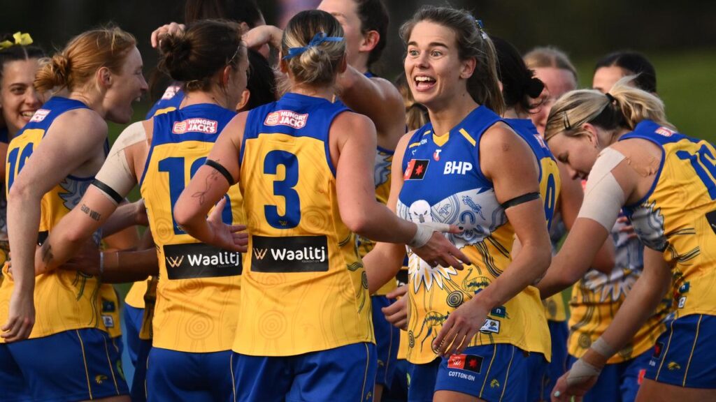 A dazzling final quarter by Ella Roberts (second right) helped the Eagles steamroll the Saints.