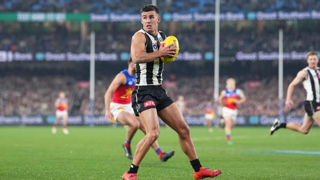 Nick Daicos makes progress for the Magpies at the MCG.