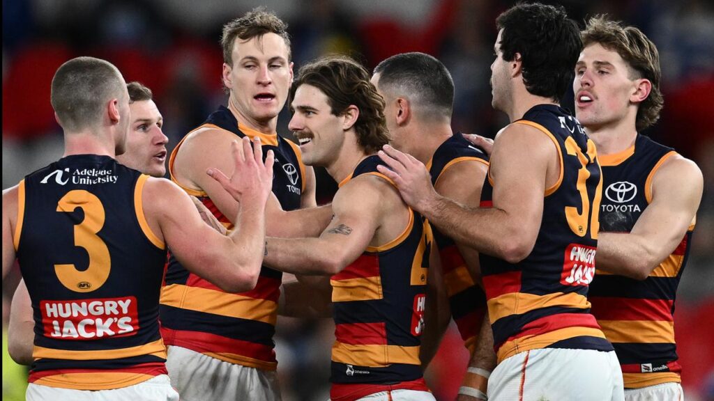 James Peatling (centre) kicked three goals as Adelaide secured the minor premiership against North.