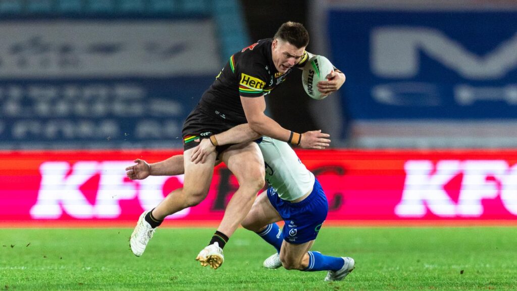 Zac Lipowicz runs at full steam in his NRL debut for defending champions Penrith against Canterbury.