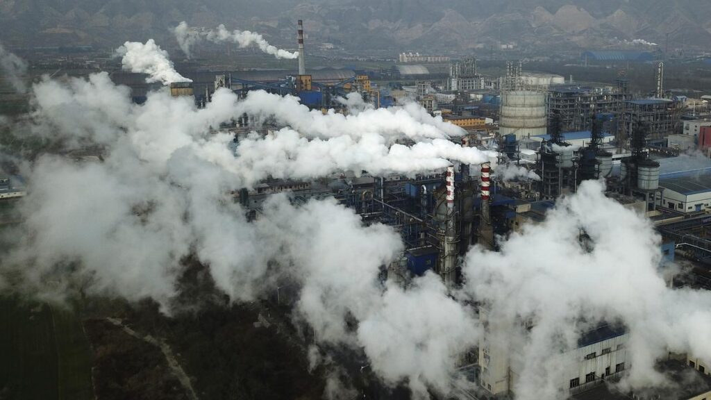 China, the biggest source of planet-warming gases, committed to a target to cut emissions at the UN.

