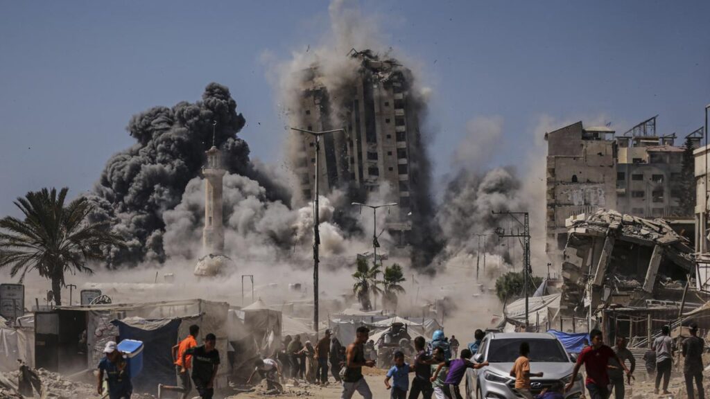 The Israeli military has bombed a high-rise building in Gaza City after warning civilians.