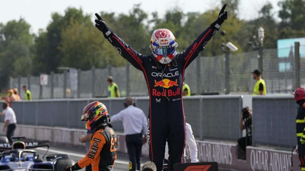 Red Bull driver Max Verstappen stands atop his Red Bull after winning the Italian Grand Prix.