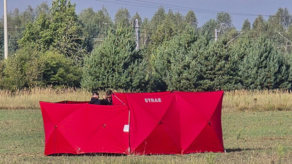 Firefighters secure parts of a damaged drone that was shot down by Polish authorities.
