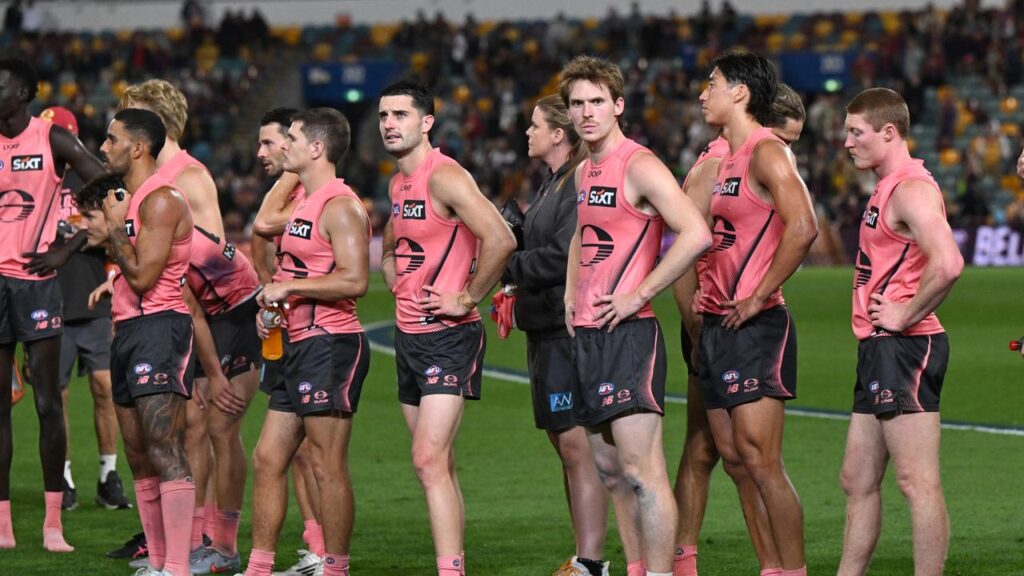 Suns players reflect after their AFL semi-final defeat to the Lions at the Gabba.