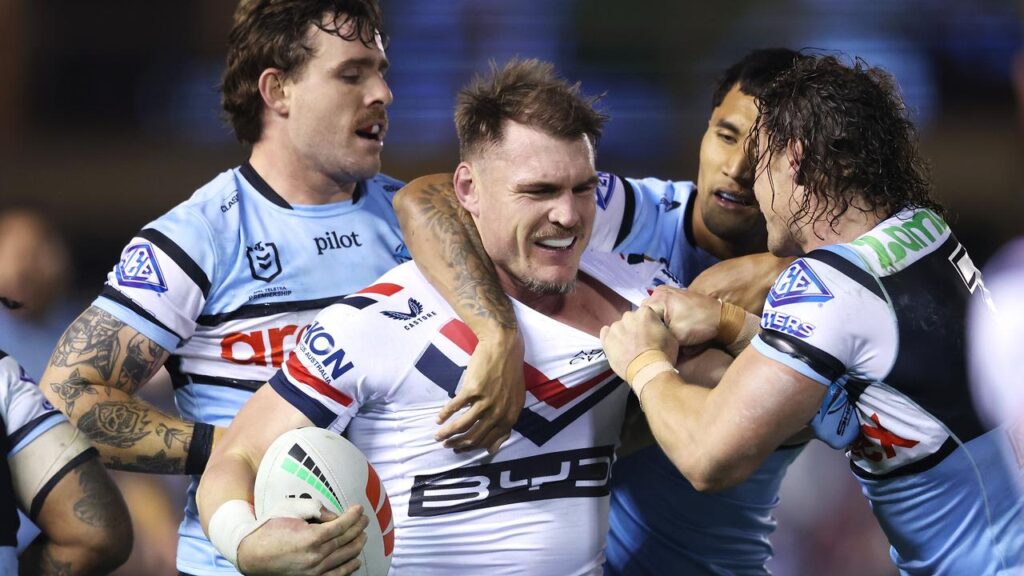 No excuses: Angus Crichton (c) is glad Nicho Hynes (r) is free to play against the Roosters.
