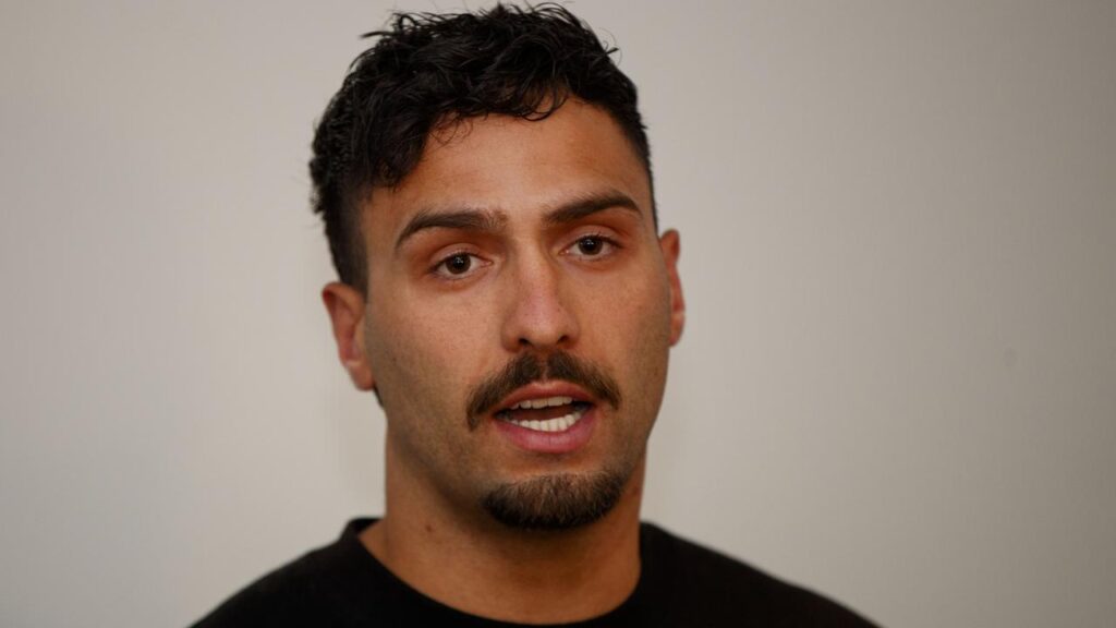 Adelaide’s Izak Rankine fights back tears during his public apology for an on-field homophobic slur.