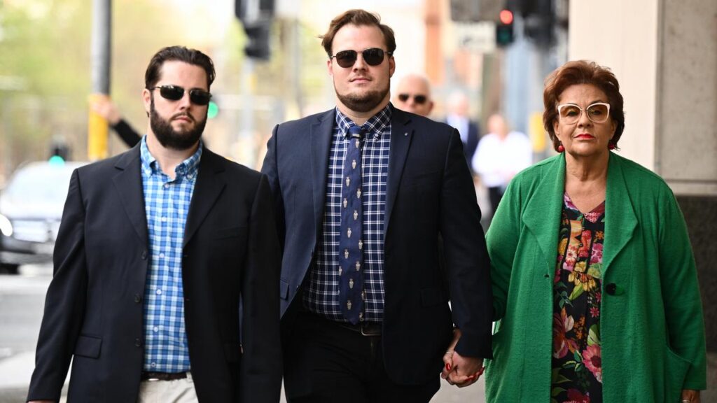 William Gulson (centre) arrives at John Maddison Tower court building, in Sydney.