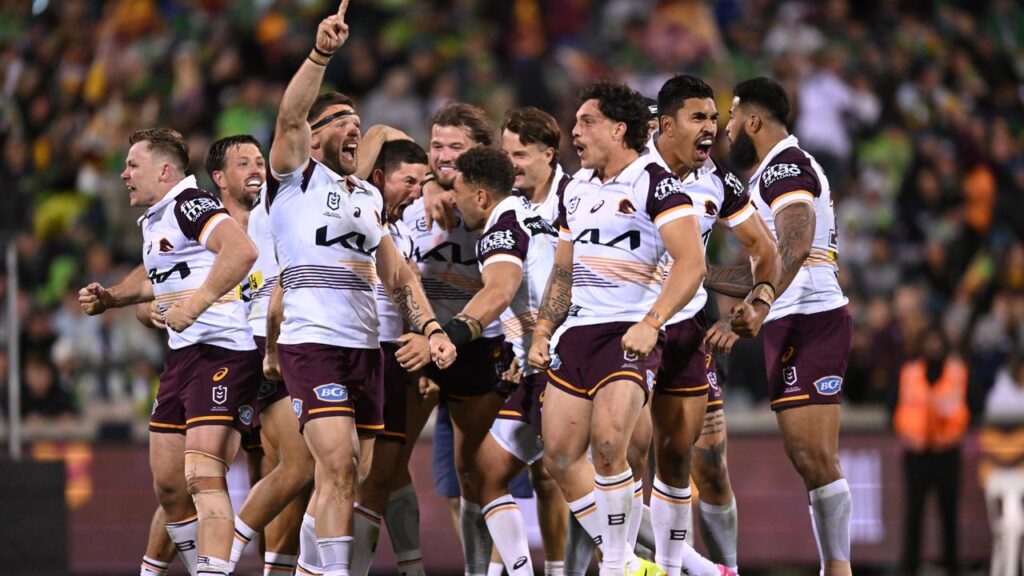 Ben Hunt (fourth left) is aiming for a premiership after kicking Brisbane to victory over Canberra.

