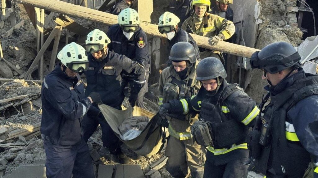 Firefighters carry a person after a Russian strike in Zaporizhzhia, Ukraine.
