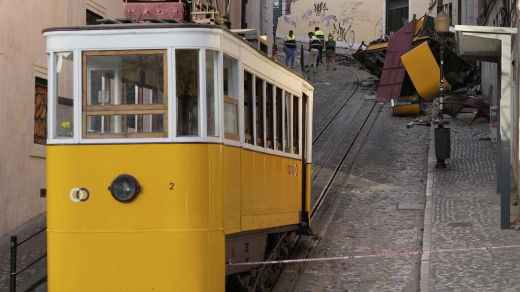 The streetcar’s wreckage is cordoned off by police as investigations continue into why to derailed.