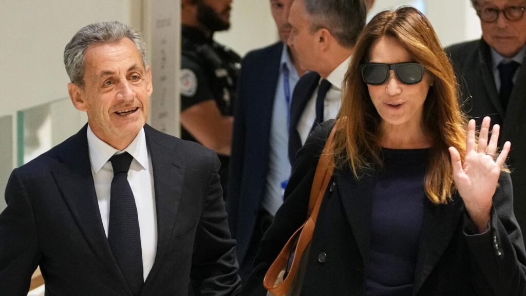 Nicolas Sarkozy and his wife Carla Bruni arrive at court in Paris to learn his fate.
