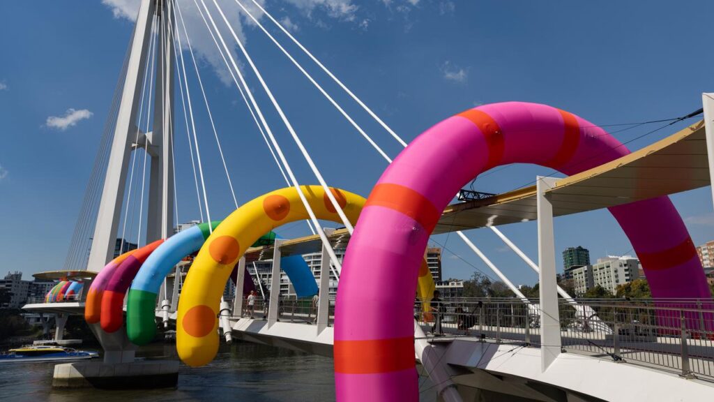 Art duo Craig & Karl have transformed three Brisbane bridges with colourful inflatables.