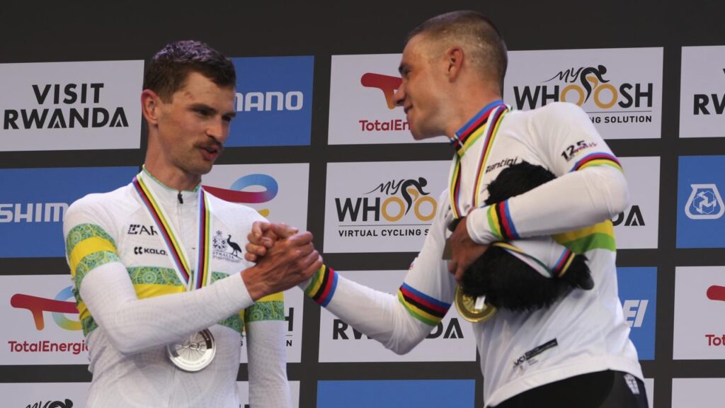 Champion Remco Evenepoel (R) congratulates Aussie Jay Vine on his silver after the world time trial.