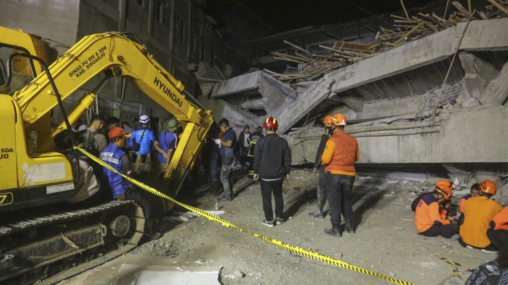 The school in East Java, Indonesia had been undergoing an unauthorised expansion when it collapsed.
