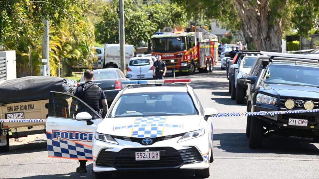 A man has been shot in a Brisbane backyard by police who were responding to a house fire.
