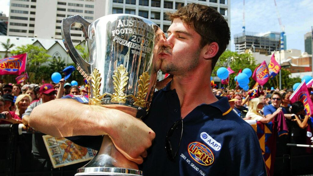 Triple-premiership winner Jonathan Brown will hand over the AFL trophy if Brisbane beat Geelong.
