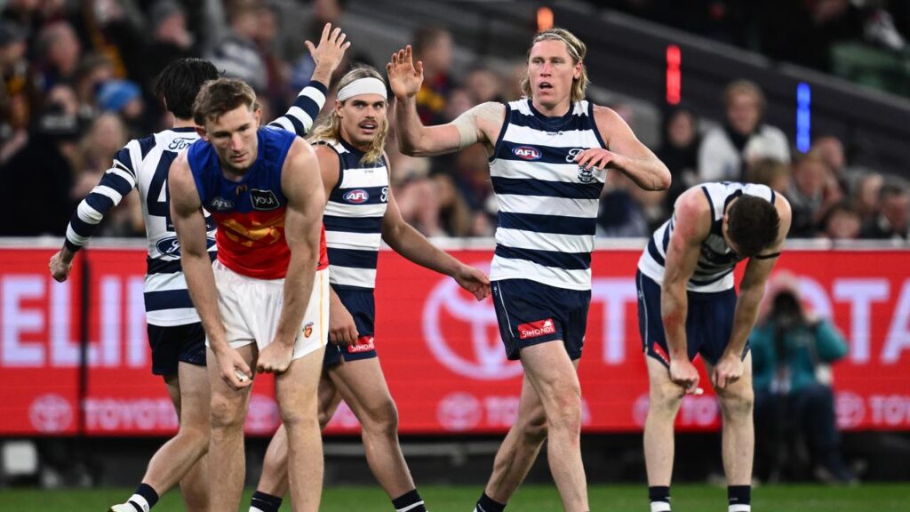 Cat Mark Blicavs (second right) may spend time on Brisbane’s Harris Andrews (left) at the MCG.
