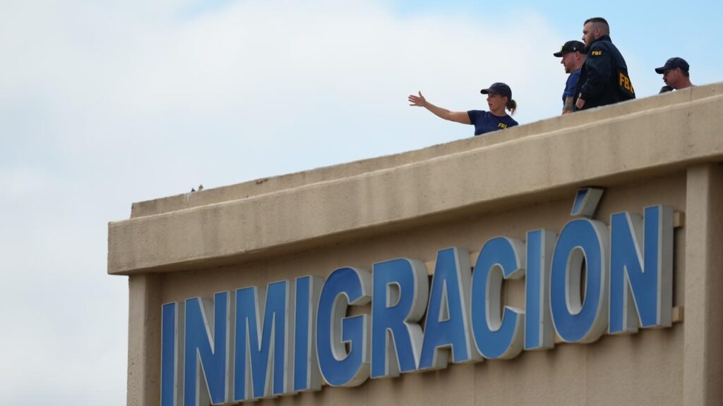 US local police say a suspect opened fire on an ICE office from an adjacent building.

