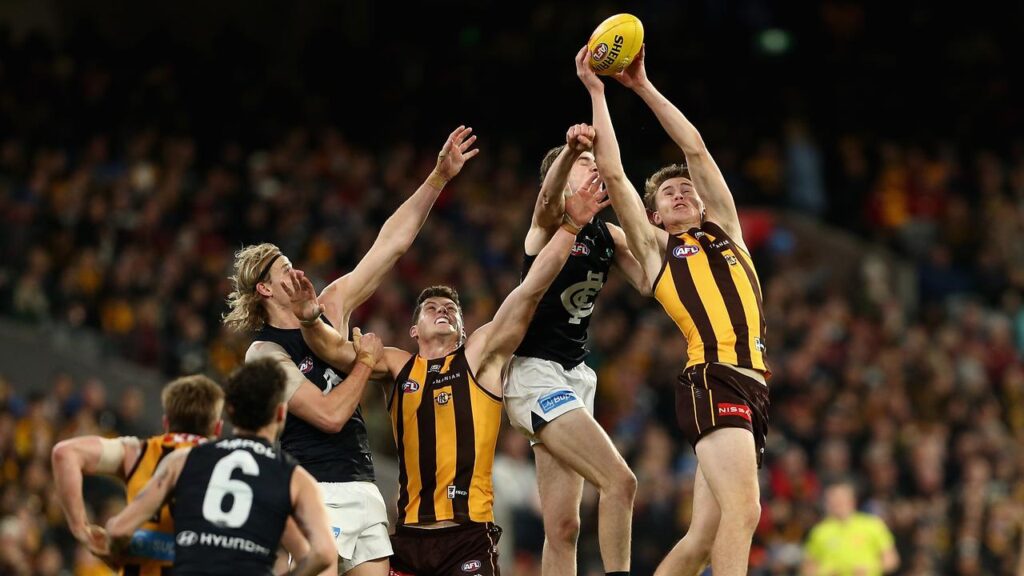 High-flying Calsher Dear (r) will miss Hawthorn’s semi against Adelaide with a hamstring injury.