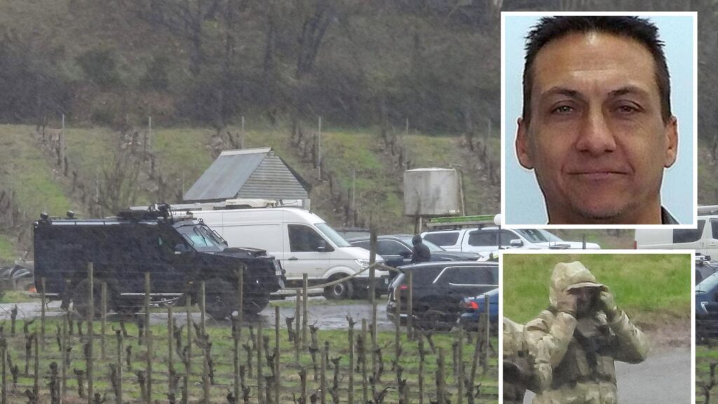 Dezi Freeman is believed to be holed-up in rugged terrain after two police officers were killed.
