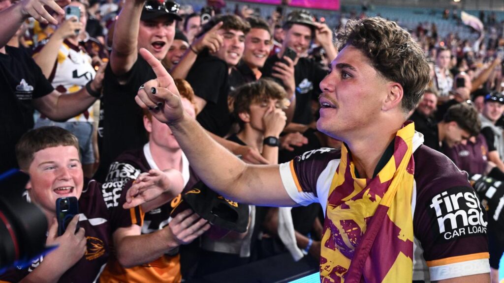 Reece Walsh enjoying his grand final win – but the Storm coach felt he should have been stopped.
