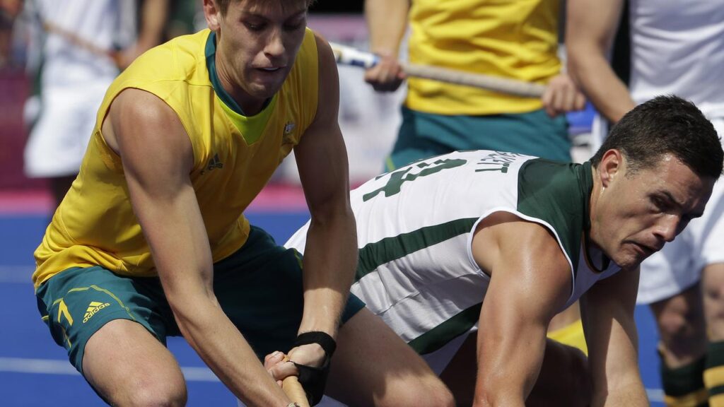 South Africa’s Rhett Halkett (R) has taken over as coach of the Hockeyroos.