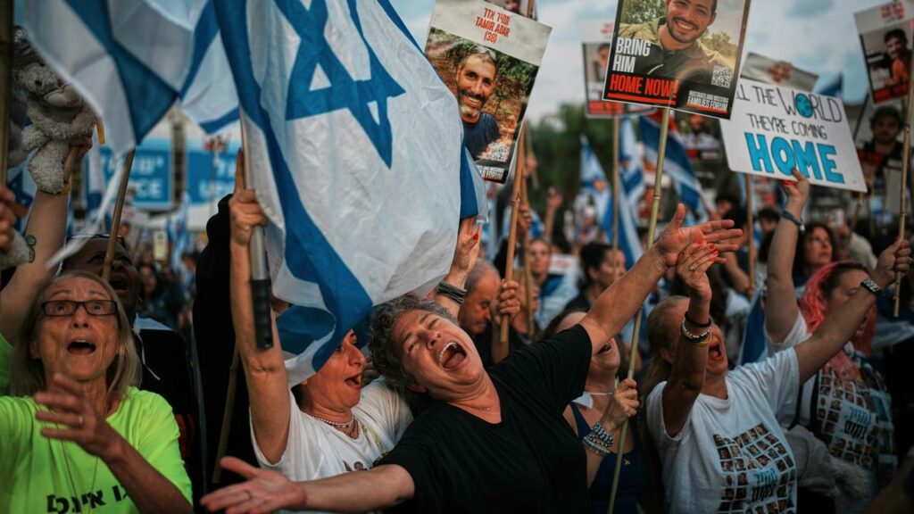 Israelis have gathered in Hostages Square in Tel Aviv to watch the return of the hostages.
