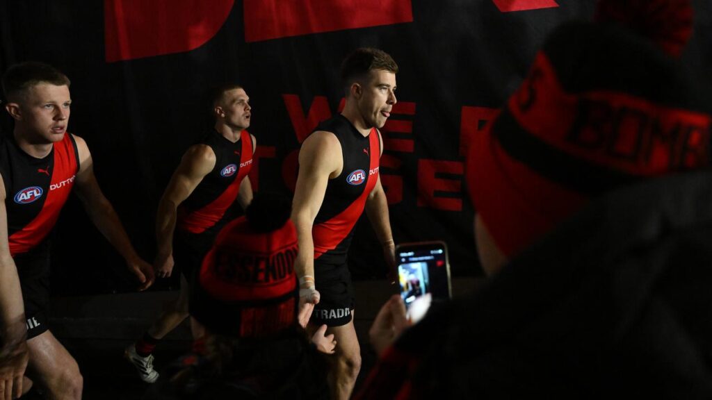 A day out from the end of the AFL trade period, the future of Zach Merrett (R) is unclear.