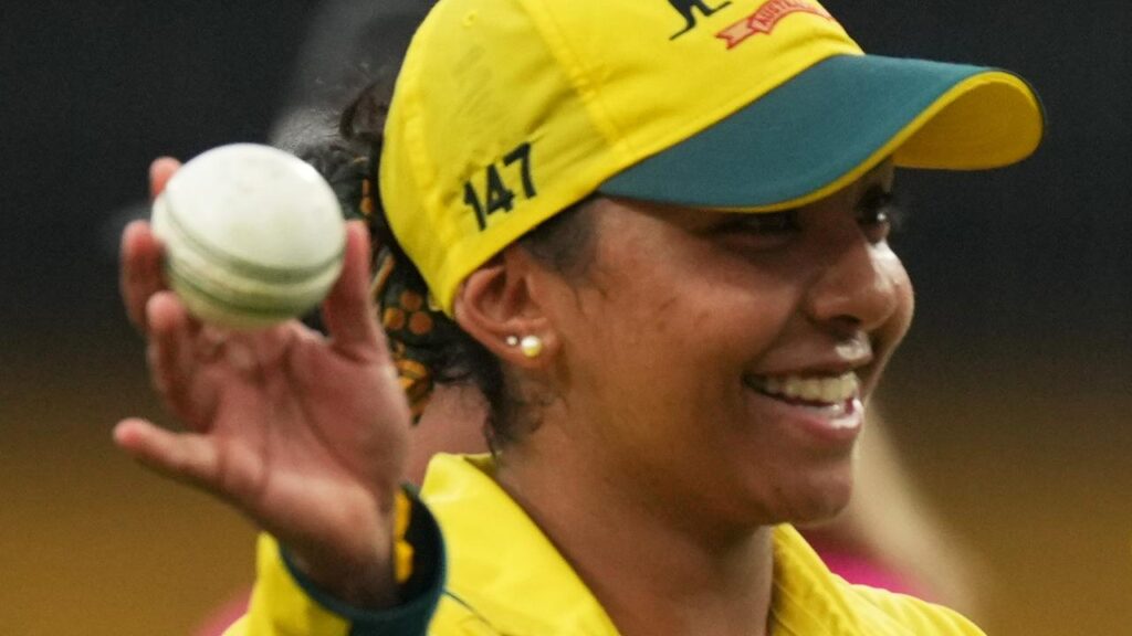 Australia’s Alana King raises the ball to the crowd after her record seven-wicket World Cup haul.