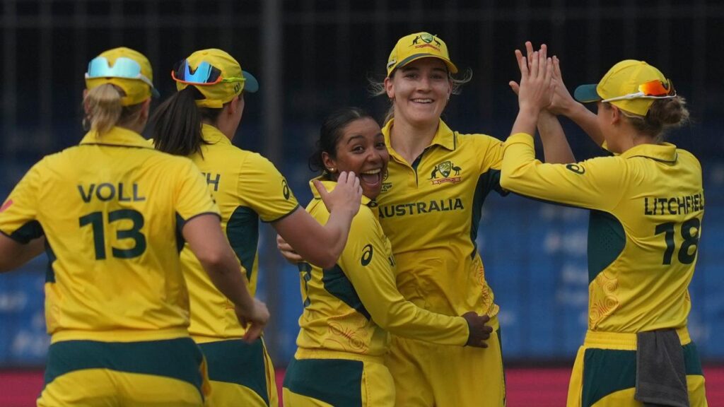 Alana King (centre) is the toast of her team after dismissing England’s Nat Sciver-Brunt.
