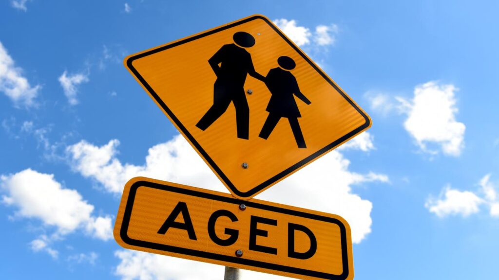 An aged care worker faces dozens of charges after an elderly man’s debit card was stolen.