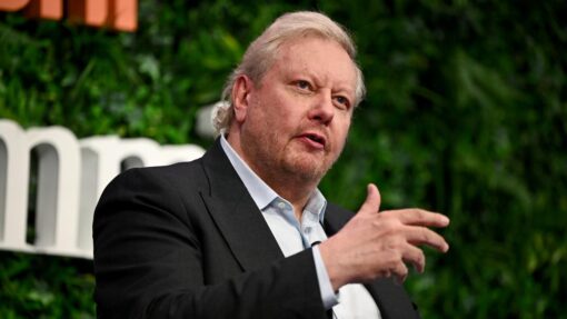 Tech giant founder targeted as federal police raid firm AFR BUSINESS SUMMIT