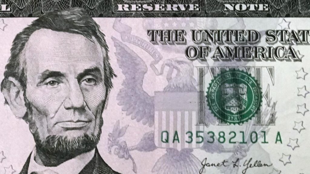 Two Federal Reserve members have dissented, with one urging a deeper cut and another no cut at all.