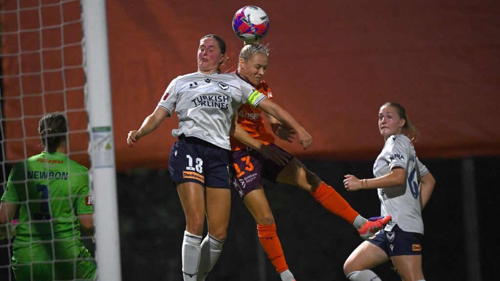 Brisbane’s Tameka Yallop rises to the occasion to head the winner against Melbourne Victory.

