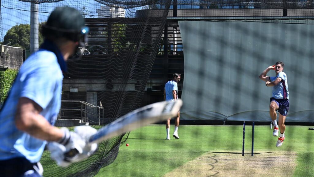 Australian cricket captain Pat Cummins bowls at Steve Smith at the SCG nets on Friday.
