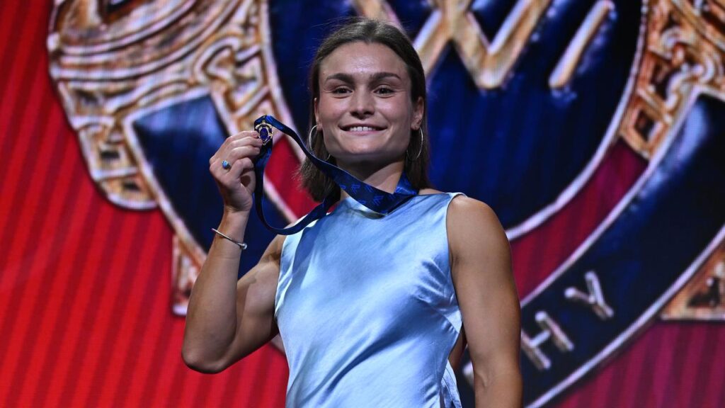 Ash Riddell says fellow Kangaroo Jasmine Garner helped lift her to the AFLW best-and-fairest award.

