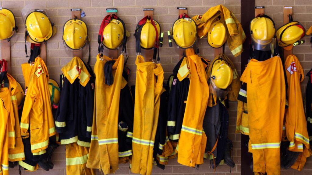 Firefighters are mourning the loss of a colleague while battling a blaze in a conservation park.
