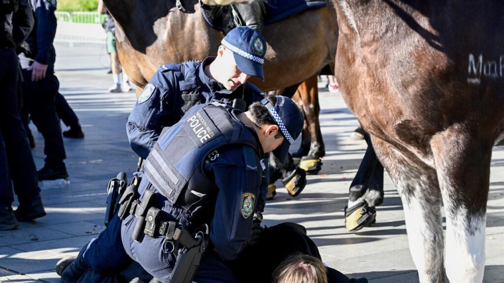 Police have arrested numerous protesters during an attempted blockade of a weapons expo.
