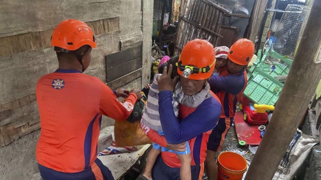 Philippine coast guard rescuers have helped move residents to safer grounds as a typhoon approached.
