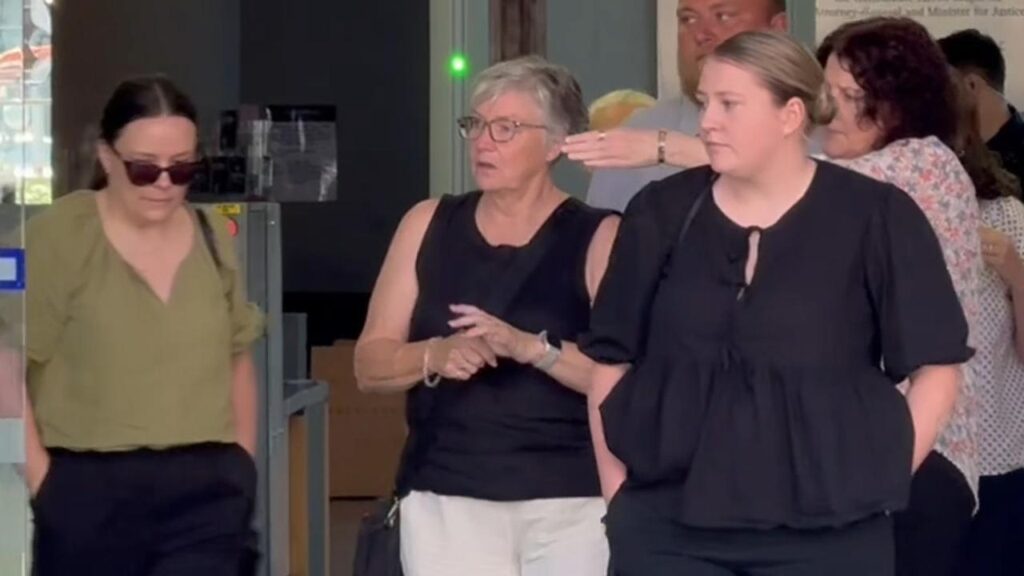 ‘I looked in his eyes as he took his last breath,” Janene Hall (centre) said of her partner.
