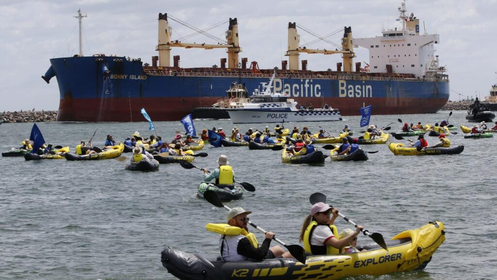 Scores of climate protesters try to block coal ships from Newcastle port. 
