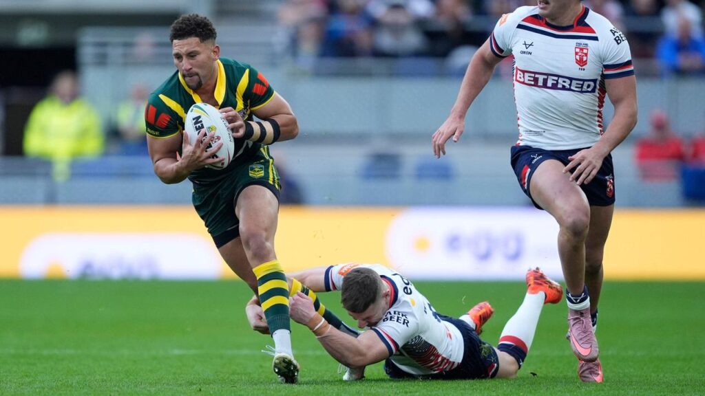 Gehamat Shibasaki powers on in the Kangaroos’ Ashes win with England’s George Williams holding on.
