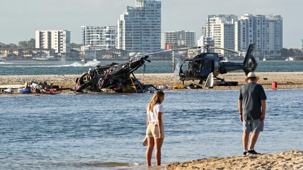 Four people died after two helicopters collided outside the Sea World theme park on the Gold Coast.
