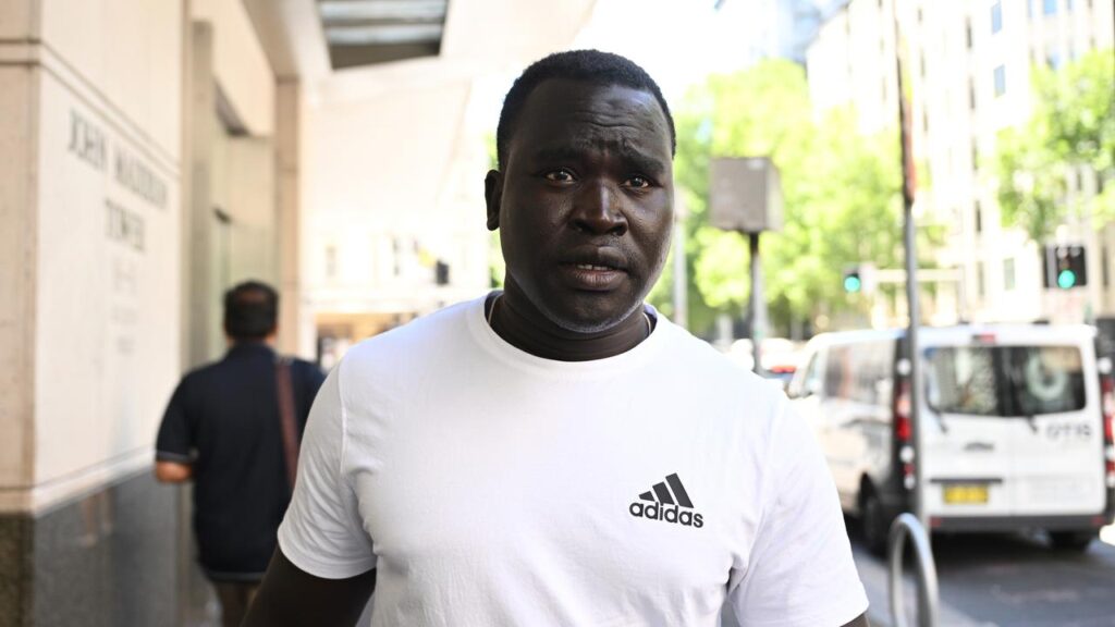 Juon Majok Mali Amuoi is one of three men facing court over the firebombing of a Jewish deli.
