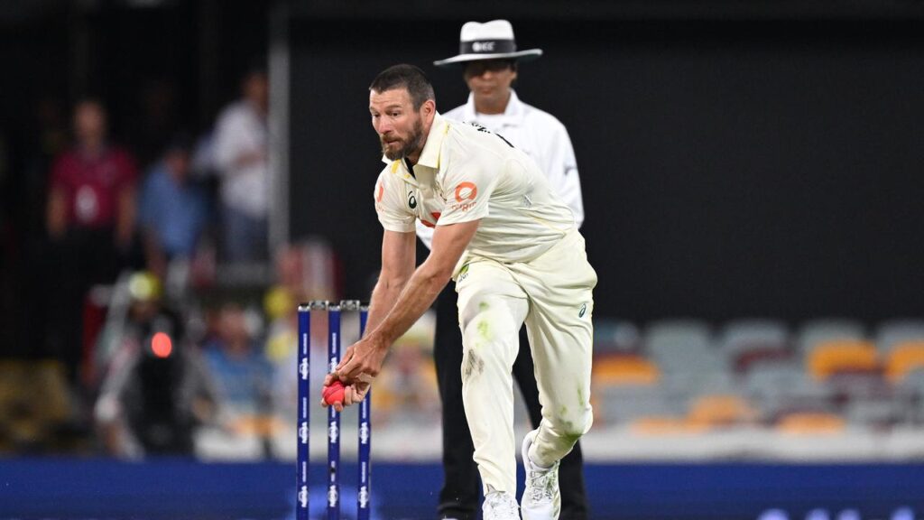 Michael Neser takes a sharp catch off his own bowling to get rid of Zak Crawley at the Gabba.
